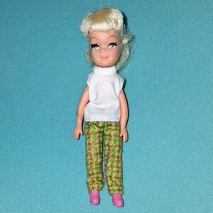 Charming Doll with White Top and Patterned Pants